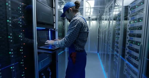 Technician Working at a Data Center