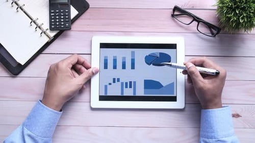 Analyzing Business Charts on a Tablet in Office