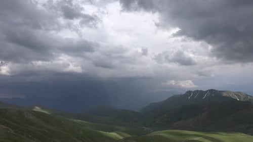 It's Raining Down Deep Valley in Mountainous Terrain