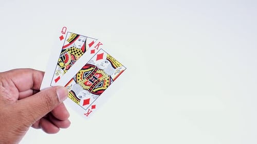 Hand Holds King And Queen Diamonds