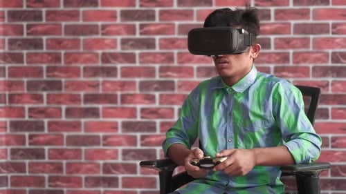 Teen Playing Video Games With Virtual Reality Headset