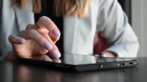 Close Up Shot of Female Hands Using Tablet Pc