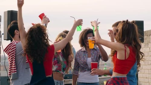 Friends Partying Together on a City Rooftop