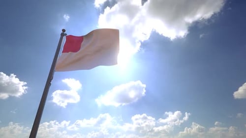 Red and White Flag Waving Against Bright Sunny Sky