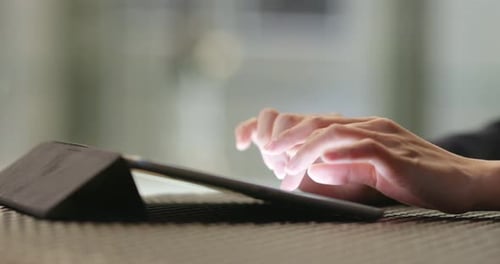 Hands Using Tablet for Digital Interaction