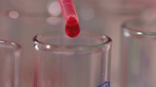 Dropper Adding Red Liquid Into Test Tube