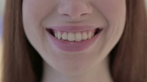 Close Up of Mouth of Smiling White Woman at Camera