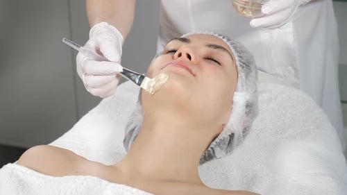 Woman Receiving Facial Mask at Spa