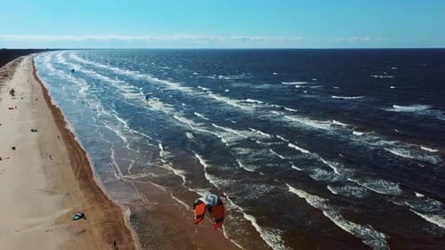 Aerial Shot of Kiteboarders and Kitesurfers of the Baltic Sea Latvia