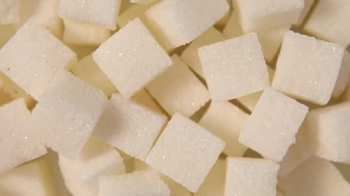 Rotation macro white sugar cubes close up texture background