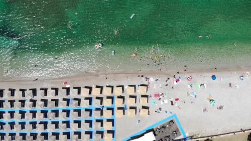 Aerial View of Beach with Umbrellas and People