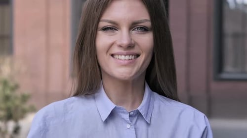 Woman Smiling Close Up in Urban Setting