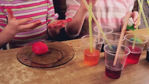 Children Paint Easter Eggs with Colorful Dyes in an Unusual Way