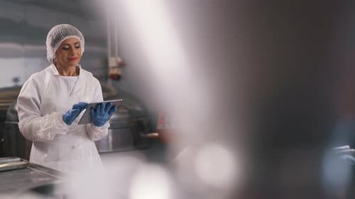 Factory Worker Working on a Tablet