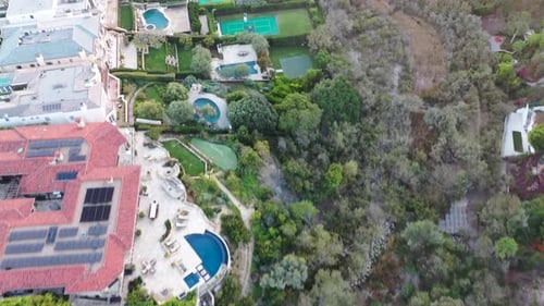 4k ariel drone shot of million dollar homes overlooking the beach in Laguna, California.