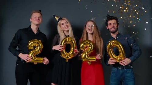 Friends Celebrating with Balloons and Confetti