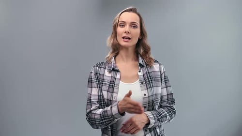 Casual Modern Woman in Checkered Shirt News Channel Presenter Speaking