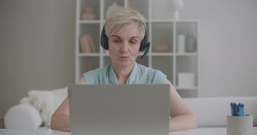 Professional Woman Video Calling from Home Office