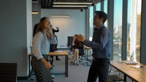 Office Workers Celebrate with a Dance Party