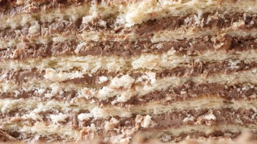 Tilting on multilayered torte with biscuits 4K 2160p 30fps UltraHD footage - Close-up layers of choc