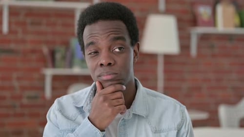 Thoughtful Young Adult Thinking and Contemplating