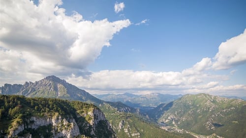 Aerial View of Mountain Range with Fast Moving Clouds
