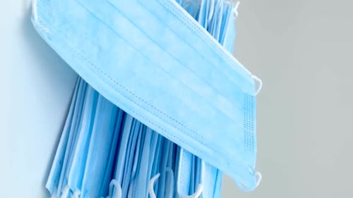 Pile of Light Blue Surgical Masks for Medical Use