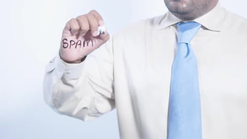 Man Writing 'Spam' on Clear Surface