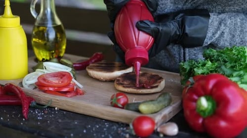 Burger Preparation with Fresh Ingredients and Ketchup