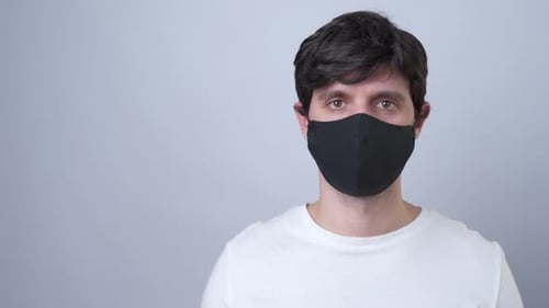 Young Adult Wearing Black Face Mask