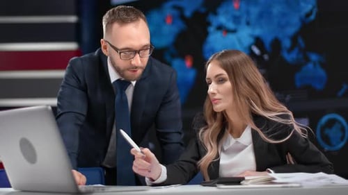 Stylish Business People Colleagues Discussing Project Profit Pointing on Screen of Laptop