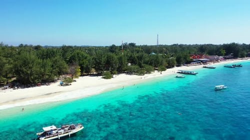 Aerial drone shot travel of exotic shore beach break by blue green lagoon and white sand background