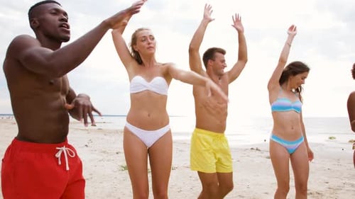 Happy Friends Dancing at Summer Beach Party