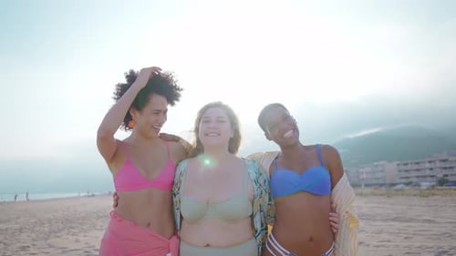 young women having fun on the beach