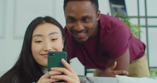 Woman Show Explain to Beloved Man New App Resting at Home Spend Time Together Use Wireless Tech