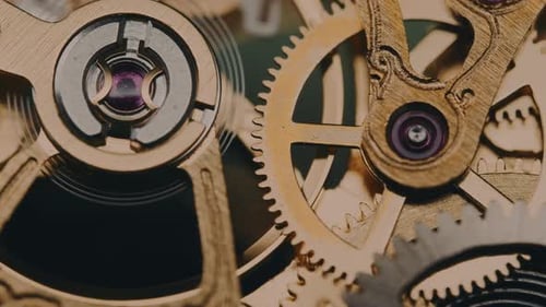 Clock Gears Turning in Intricate Mechanism Close-up