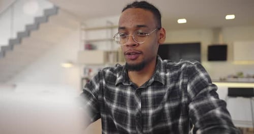 Young Adult on Video Call at Modern Home