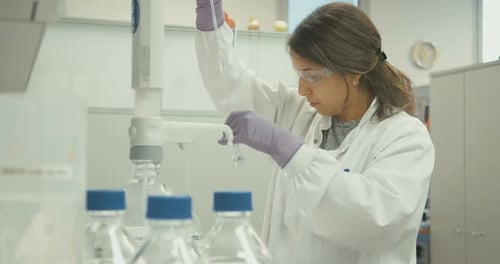 Female Scientist Conducting Research in Bright Laboratory