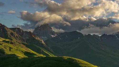Green Mountains and Clouds at Sunset