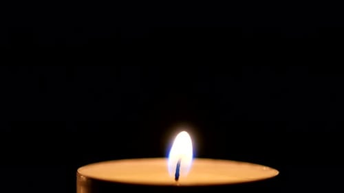 Candle Light on Black Background