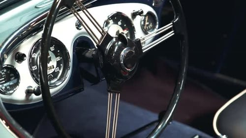 Close-up of Black-metal Steering Wheel of Vintage Vehicle
