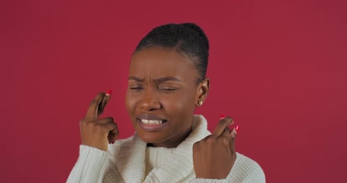 Woman Crossing Fingers Hoping For Good Luck