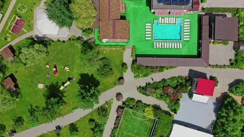 Green parks and playgrounds in recreation area. Modern resort area among nature in summer.