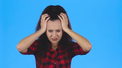 Young Woman Has a Headache. Slow Motion