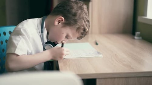 Schoolboy Doing Homework Close Up