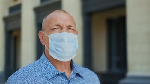 Adult Wearing a Face Mask in Urban Setting