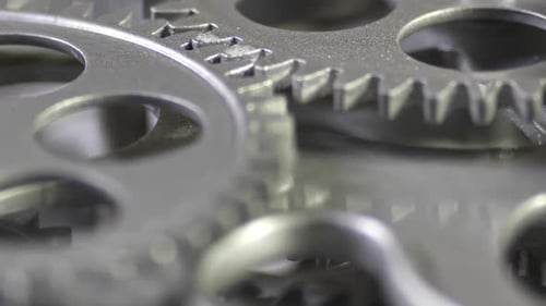 Rotating Silver Gears Macro Shot