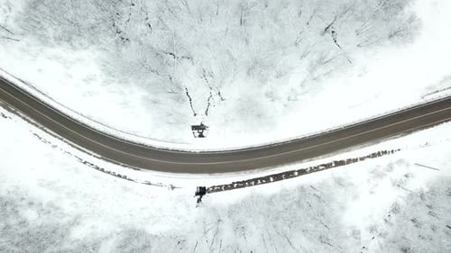 Drones Eye View Winding Road From the High Mountain Pass in Winter