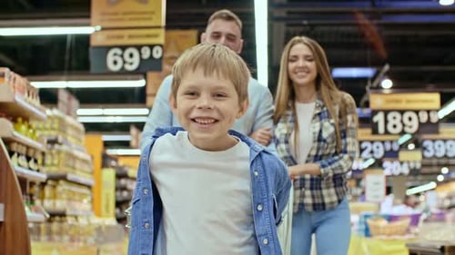 Happy Kid Enjoying Shopping with Parents