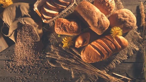 Still life with Bread, Wheat, Flour and Flowers.